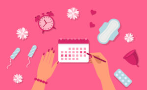 tampons, clock, calendar on pink background - period concept