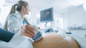 provider performing ultrasound on pregnant patinet