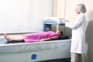 woman undergoing bone density scan