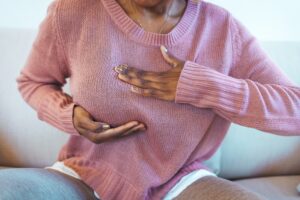 Woman suffering with mastitis. 