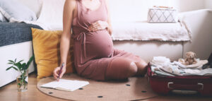 pregnant woman packing for hospital delivery.