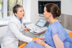 female doctor talking to woman.