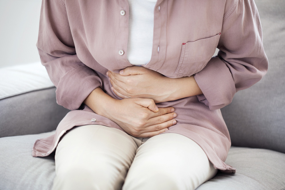 woman with stomach pain callout