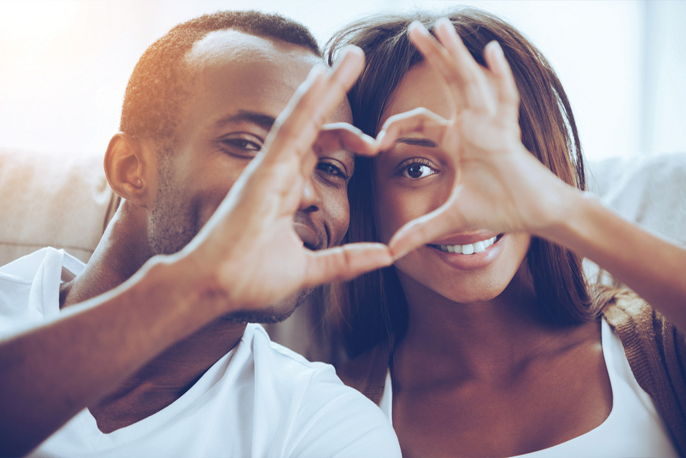 couple making heart symbol callout