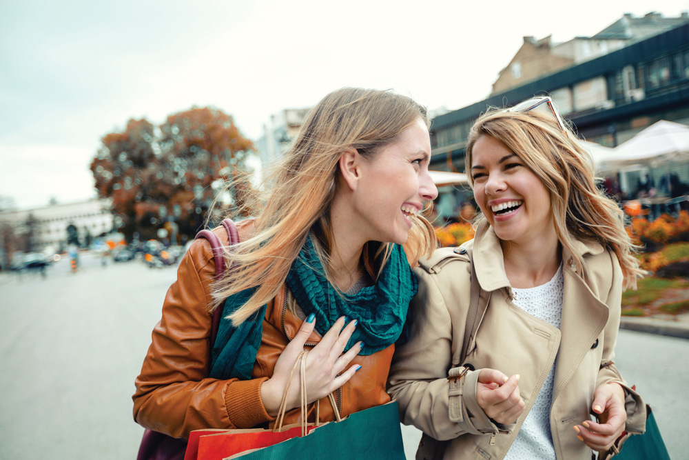 two women laughing together callout