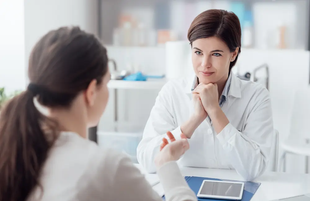 woman talking to doctor
