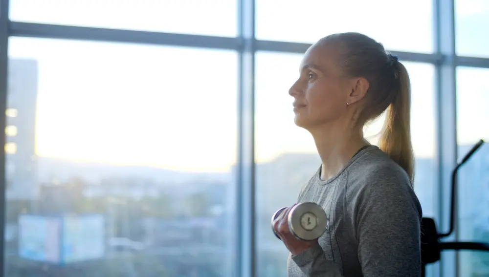 Menopausal woman with PCOS exercising.
