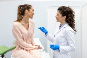 woman smiling at doctor